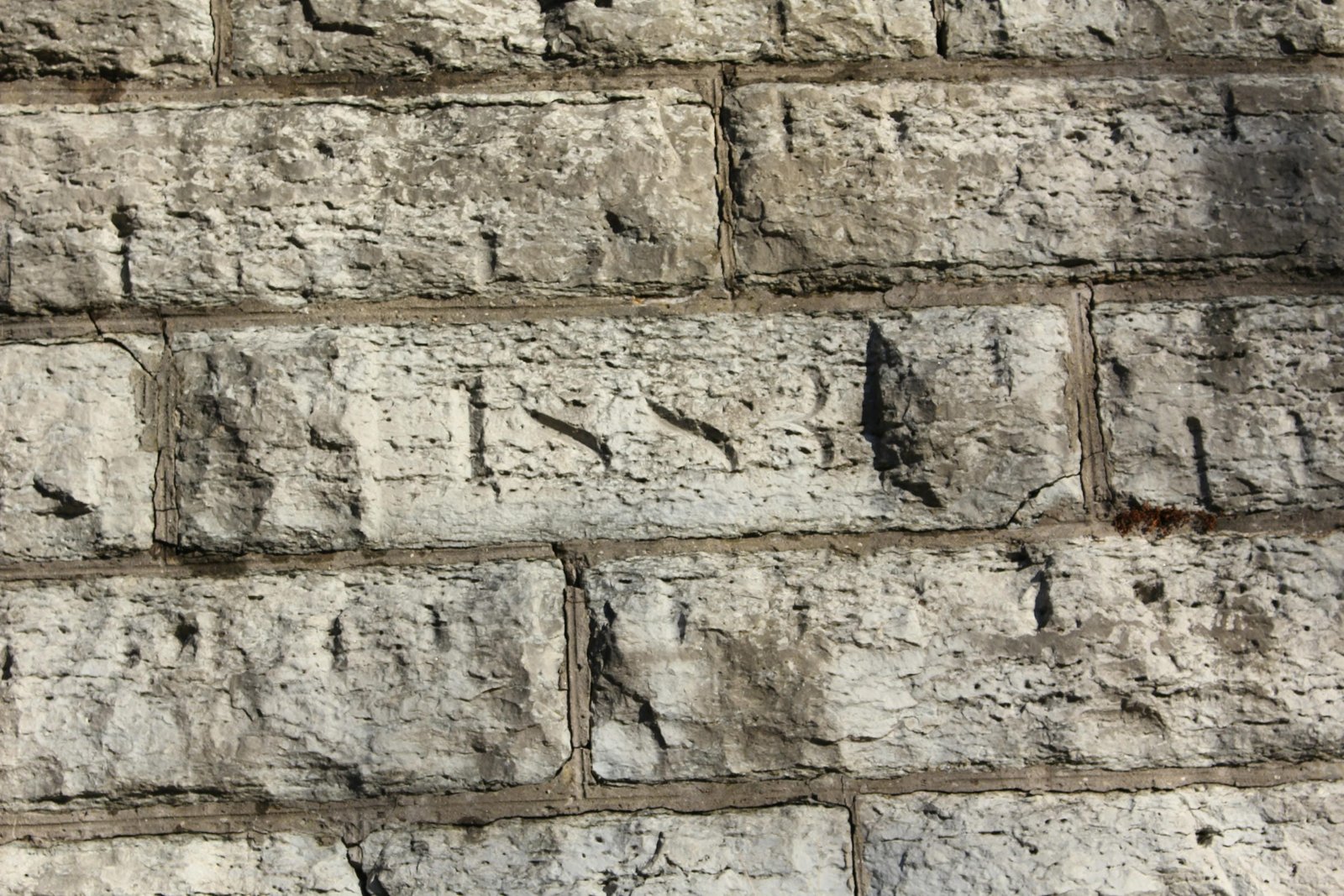 Date stone, west face